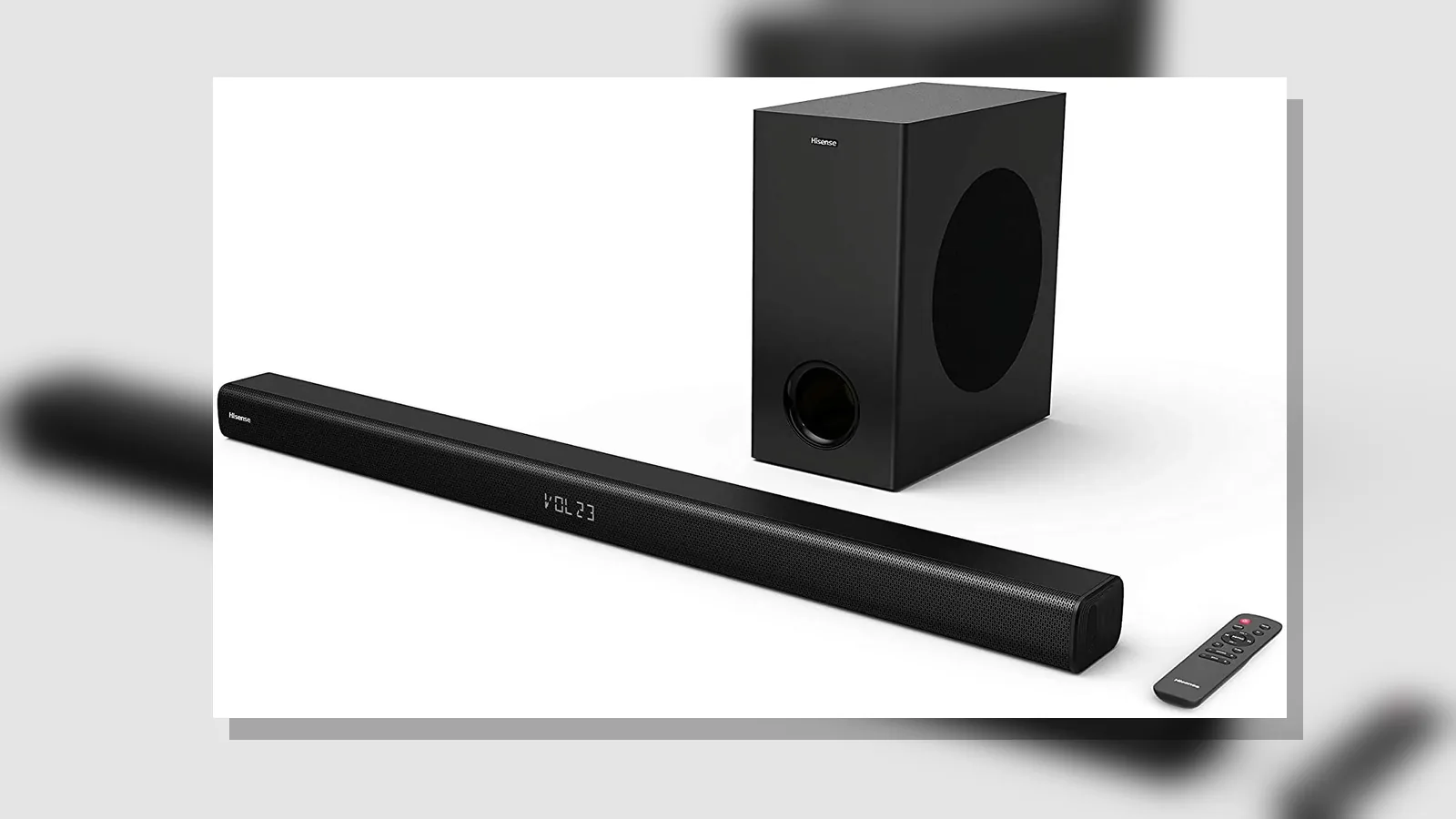 HDMI cable and remote on a TV stand in front of a soundbar during lip-sync troubleshooting